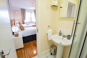 Bathtub, hair dryer, towels, soap