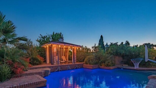 A swimming pool with a small gazebo and a basketball hoop. - Entertainer's Dream Home! 3 Bdrm, Pool, Games! (Phoenix)