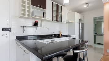 Apartment | Private kitchen | Full-size fridge, microwave, cookware/dishes/utensils