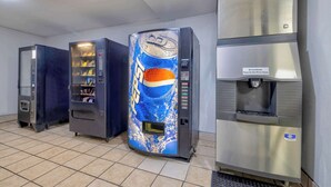 A row of vending machines, including a Pepsi cooler and a water dispenser, in a commercial setting. - Studio 6 Little Rock, AR - South (Little Rock)