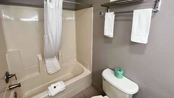 Combined shower/bathtub, towels, soap, toilet paper