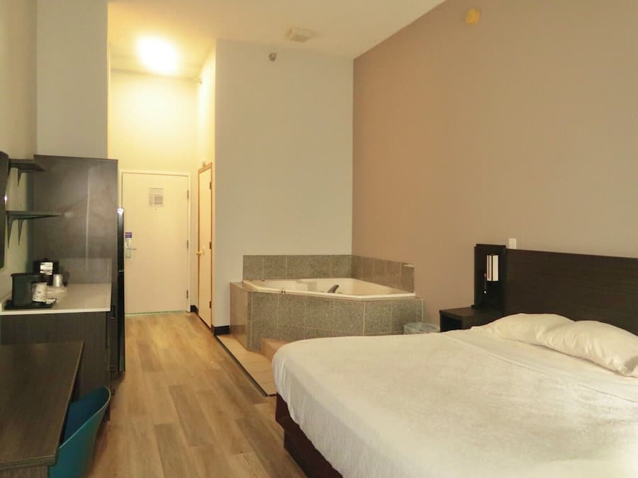 Desk, laptop workspace, blackout drapes, iron/ironing board