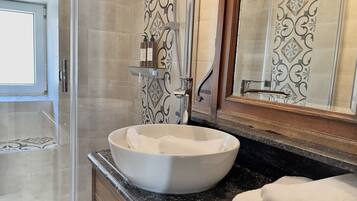 Shower, hair dryer, slippers, towels