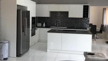 Apartment | Private kitchen | Fridge, microwave, oven, stovetop