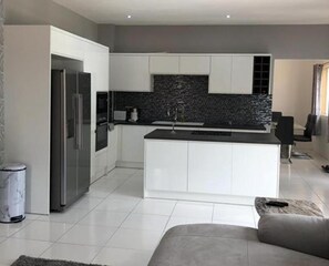 Apartment | Private kitchen | Fridge, microwave, oven, stovetop
