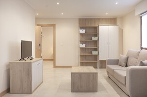 Family Apartment | Living area | 32-inch flat-screen TV with digital channels