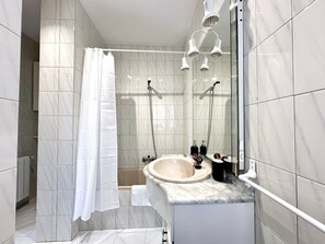 Bathtub, hair dryer, towels