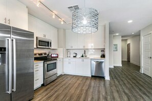 Fridge, microwave, stovetop, dishwasher - Spacious Condo in California Building (New Orleans)