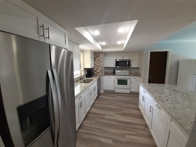 2 houses 5bed 4bath heated pool prime location