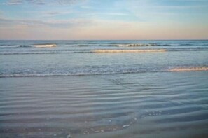 On the beach, sun loungers, beach towels