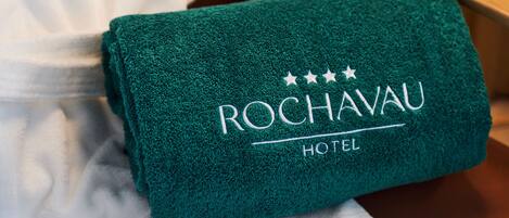 A green towel with the text "ROCHAVAU HOTEL" and three stars above it.