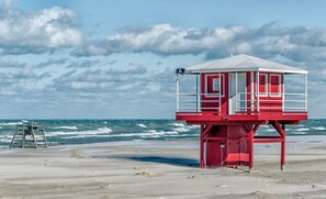 A lifeguard tower on a beach with a view of the ocean. - Spacious home for travelers.  Big discount for monthly renters. (Michigan City)