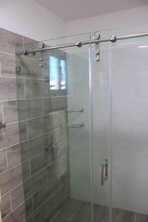 Shower, hair dryer, towels, soap