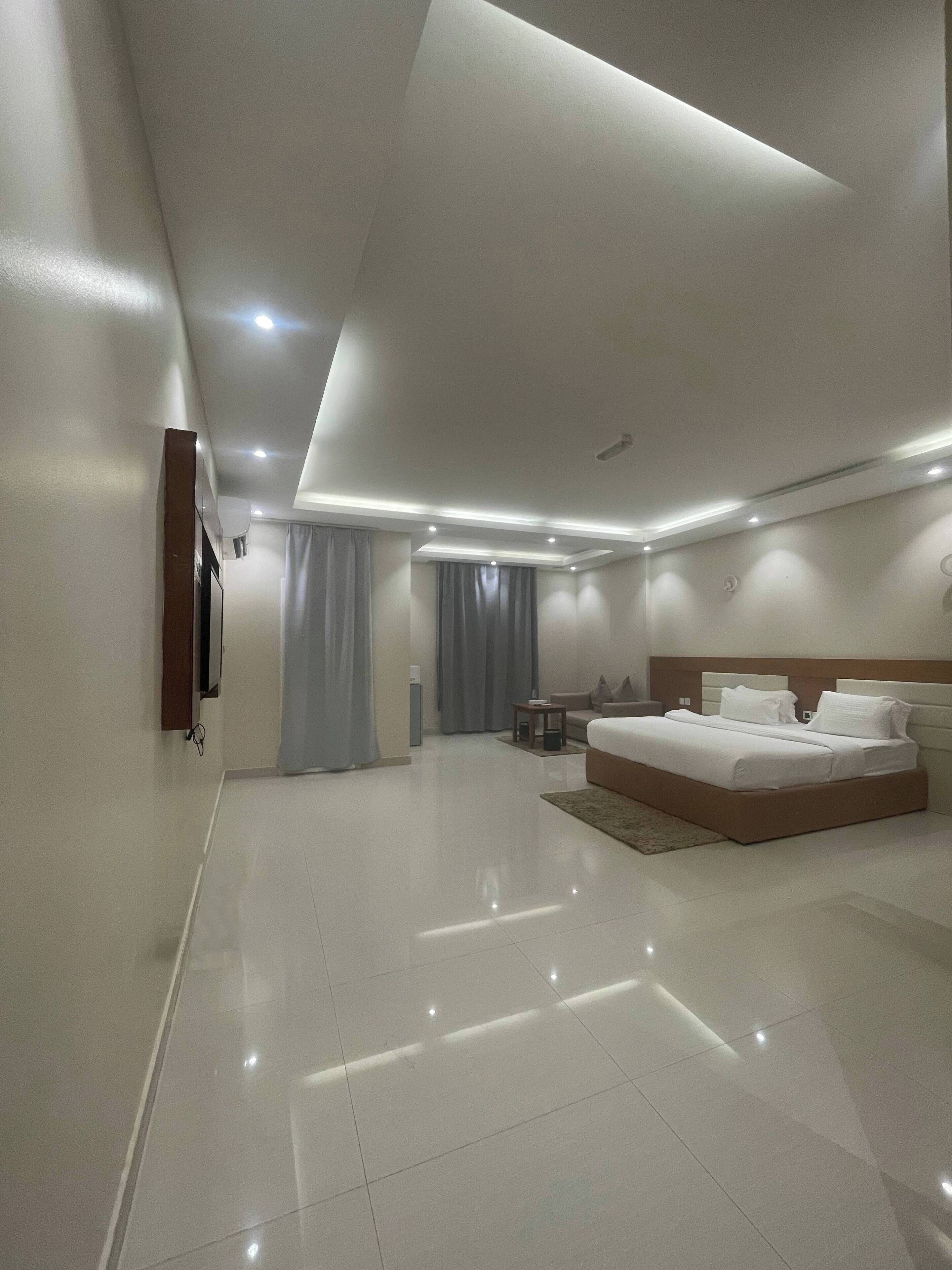 Habitación Deluxe | Ropa de cama de alta calidad y colchones con acolchado adicional