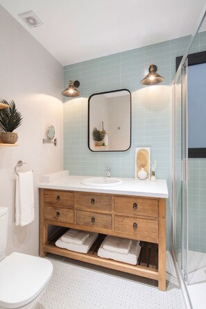 Shower, hair dryer, towels, soap