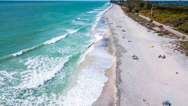 A beach with clear turquoise waters and a sandy shore. - Newly Updated House on Double Lot (North Port)