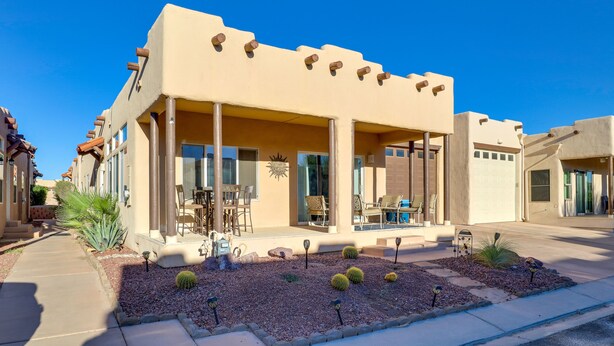 A modern house with a covered patio, large windows, and a landscaped garden with cacti. - Pet-Friendly Needles Vacation Rental Near River! (Needles)