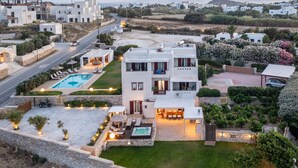 A modern villa with a swimming pool, outdoor seating, and a well-maintained garden. - Villa with Private Pool & Jacuzzi Naxos (Naxos)