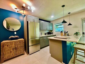 Fridge, microwave, stovetop, coffee/tea maker