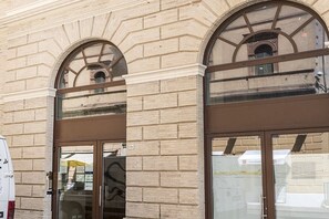 A building with arched windows and a brick facade.
