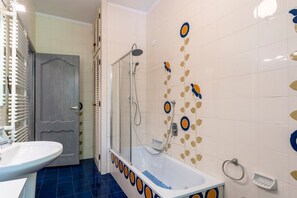 Combined shower/tub, hair dryer, bidet