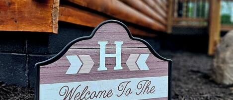 A welcome sign for Haywire Haus.