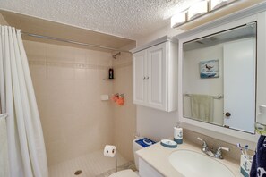 A bathroom with a shower, toilet, sink, and mirror. - Ocean-View Key Colony Beach Condo w/ Pool Access! (Key Colony Beach)