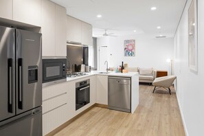 Fridge, microwave, oven, stovetop - CASSA ONE - Luxury 2 Bed Apt in Brisbane City (Brisbane)