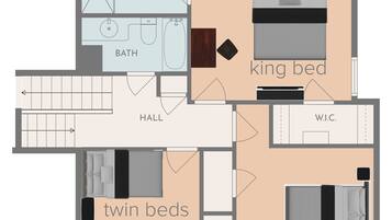 A hotel room layout with a king bed, queen bed, twin beds, a hall, and two bathrooms.