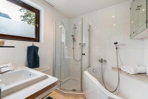 Bathtub, hair dryer, towels
