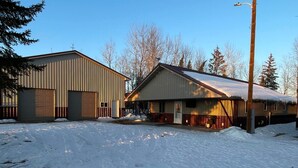 A large industrial building with a metal exterior and a covered loading dock. - Lazy Fox Lodge, Lake of the Woods
 (Baudette)