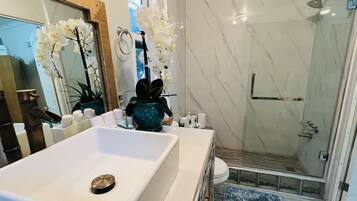 Shower, hair dryer, towels, soap