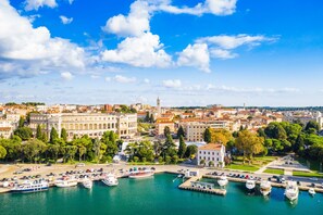Experience the blend of heritage and modernity in this vibrant coastal city, where historic buildings meet a lively marina and scenic waterfront promenade.