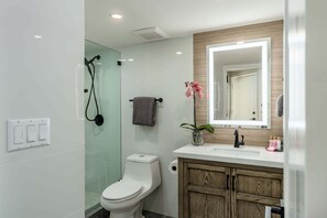 Shower, hair dryer, towels, shampoo