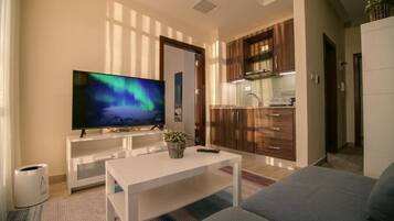 Apartment, 1 Bedroom | Living area | 55-inch Smart TV with digital channels, TV