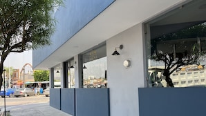 A modern building with large windows and a blue exterior. - Hotel La Bikina (Tequila)
