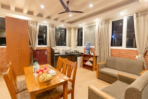 Apartamento Deluxe | Zona de estar