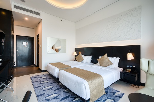 Economy Double or Twin Room | Living area | 42-inch flat-screen TV with satellite channels, TV