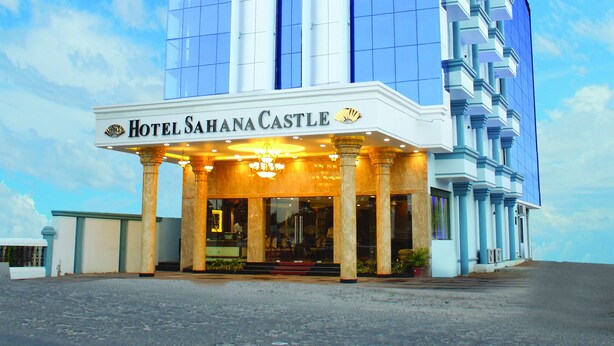 A hotel with a prominent entrance, large windows, and a classic architectural design. - Hotel Sahana Castle (Nagercoil)