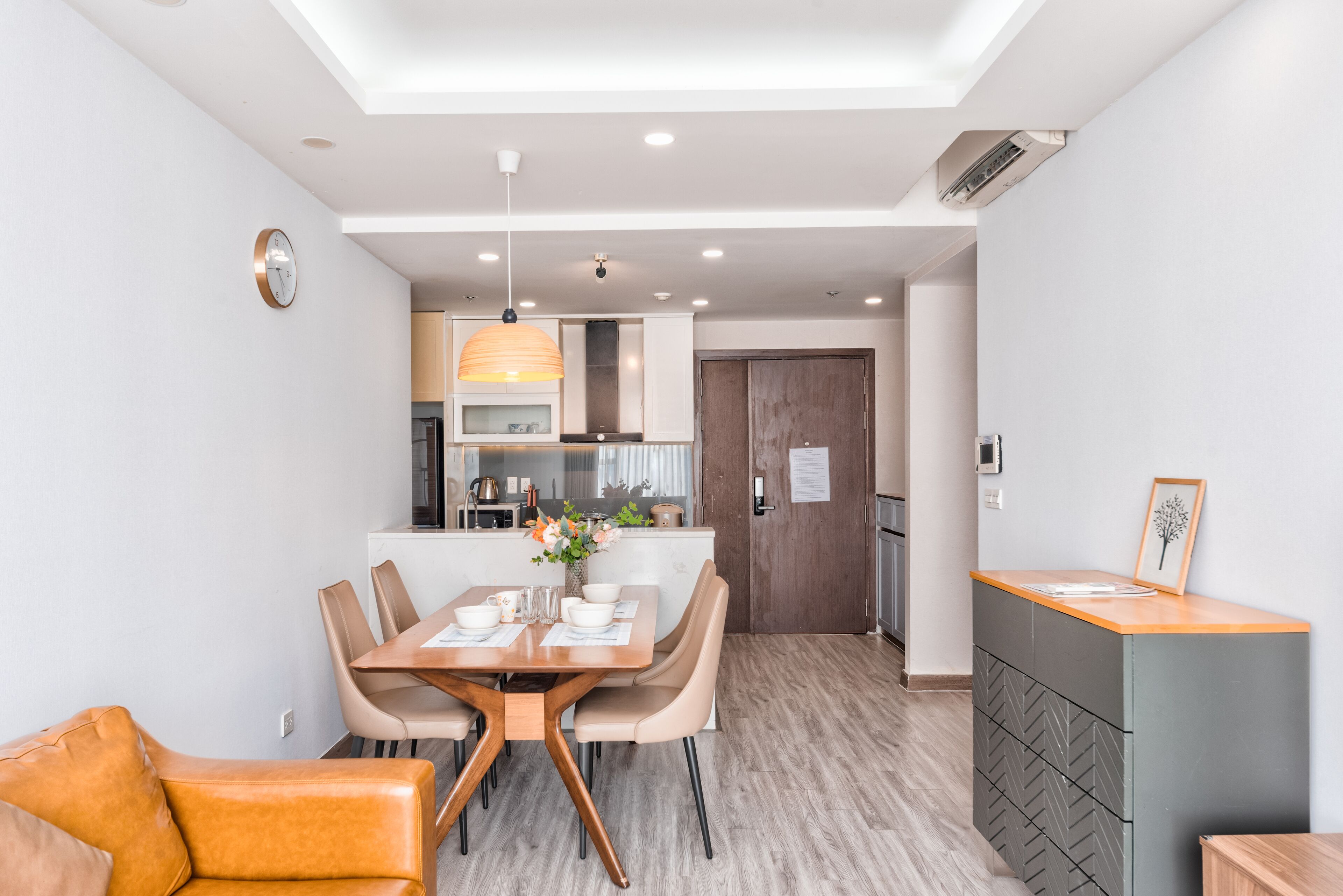 A modern kitchen with a dining area.