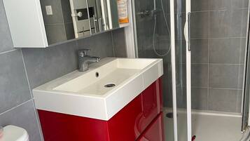 Ducha, secador de pelo, toallas