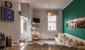 Deluxe Apartment | Living area | 32-inch Smart TV with satellite channels, TV