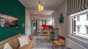 Deluxe Apartment | Living area | 32-inch Smart TV with satellite channels, TV