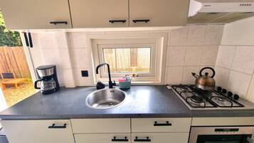 Fridge, microwave, stovetop, coffee/tea maker