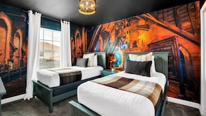A room with two beds, a large mural on the wall, and a window with curtains.