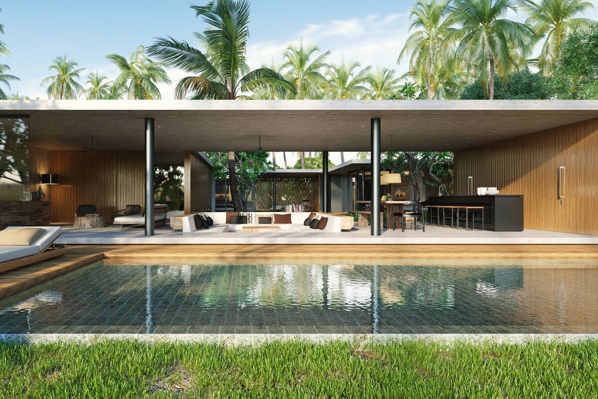 A modern outdoor pool area with lounge chairs, a dining area, and a view of palm trees.