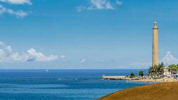 On the beach, sun loungers, beach towels