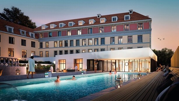 A hotel with a swimming pool, outdoor seating, and a covered area.