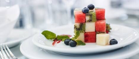 A dessert on a white plate with a fork beside it.