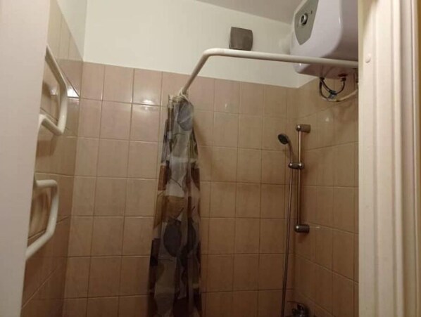 Shower, towels, soap, toilet paper